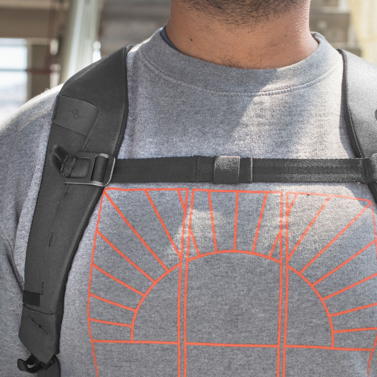 Man removing laptop from Everyday Backpack