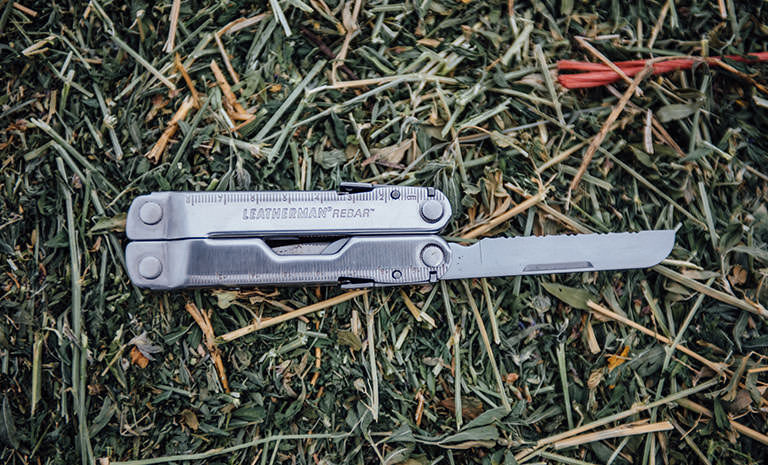 Leatherman Rebar on grass, knife blade open